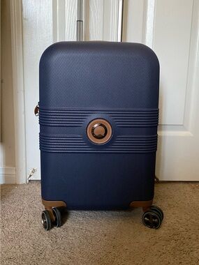 Delsey Paris Navy Carry-On Spinner Suitcase with Brown Accents